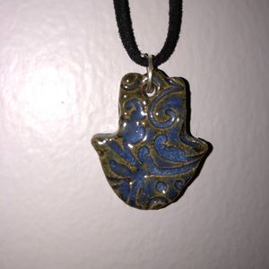 Necklace with two hand-made charms